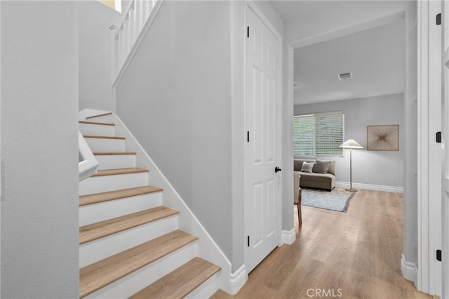 11824 Stonefield Dr, Corona, CA 92883 - staircase with wood finished floors and baseboards