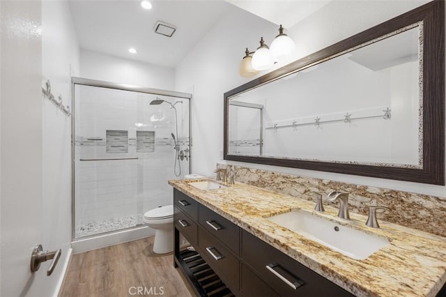 4822 Tiara Dr Unit 104, Huntington Beach, CA 92649 - full bathroom with a stall shower, wood finished floors, double vanity, and recessed lighting