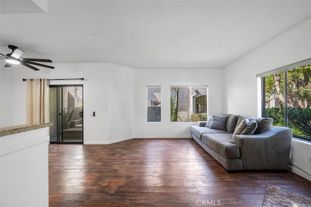 4822 Tiara Dr Unit 104, Huntington Beach, CA 92649 - living area featuring dark wood finished floors, ceiling fan, and a textured ceiling