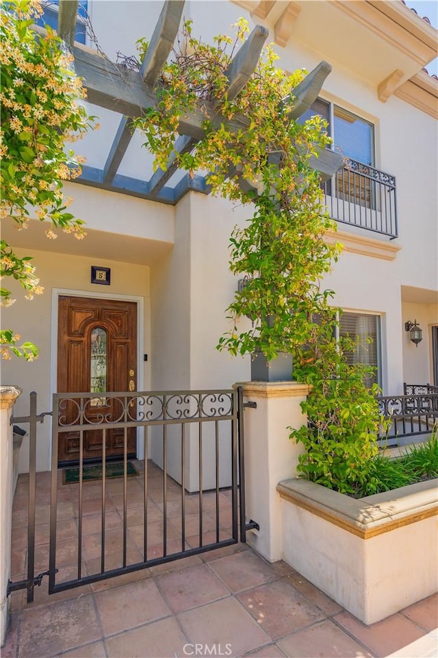 332 Allendale Rd Unit 5, Pasadena, CA 91106 - view of exterior entry with stucco siding and a gate