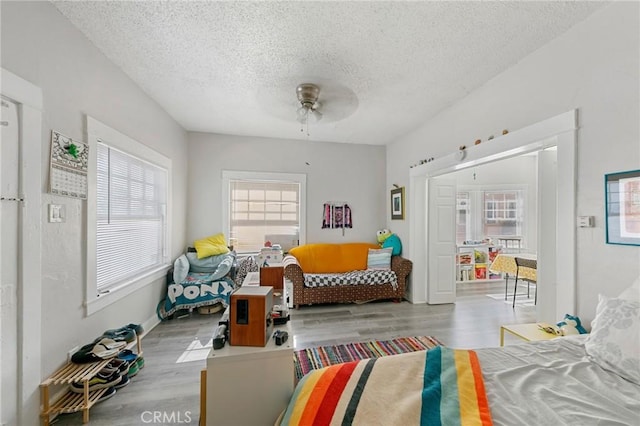 426 E 17th St, Long Beach, CA 90813 - bedroom featuring a textured ceiling, wood finished floors, and ceiling fan