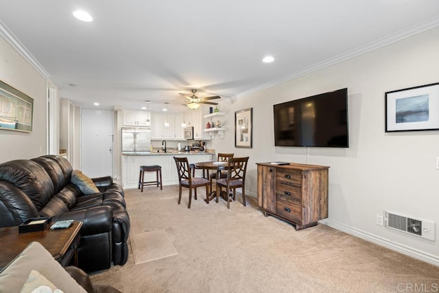 999 N Pacific St Unit A208, Oceanside, CA 92054 - living area featuring light carpet, recessed lighting, ornamental molding, and a ceiling fan