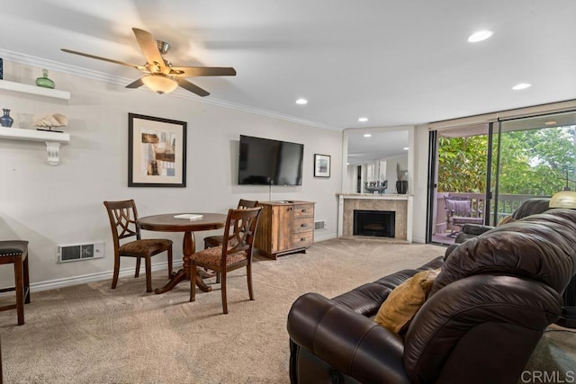 999 N Pacific St Unit A208, Oceanside, CA 92054 - living area with light carpet, ornamental molding, a fireplace, recessed lighting, and ceiling fan