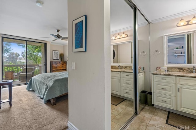 999 N Pacific St Unit A208, Oceanside, CA 92054 - bedroom featuring crown molding, access to exterior, and connected bathroom