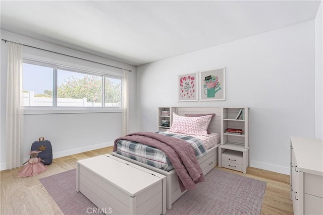 708 S Redondo Ave, Manhattan Beach, CA 90266 - bedroom with baseboards and light wood-style floors