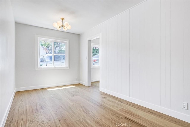 708 S Redondo Ave, Manhattan Beach, CA 90266 - spare room featuring a chandelier and light wood-style flooring