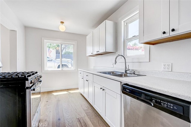 708 S Redondo Ave, Manhattan Beach, CA 90266 - kitchen with appliances with stainless steel finishes, light wood finished floors, and white cabinets