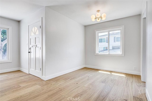 708 S Redondo Ave, Manhattan Beach, CA 90266 - foyer with a chandelier and light wood-style floors