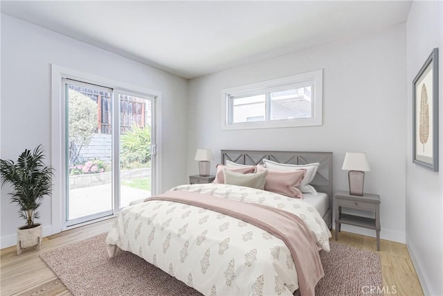 708 S Redondo Ave, Manhattan Beach, CA 90266 - bedroom featuring access to exterior and light wood-style floors