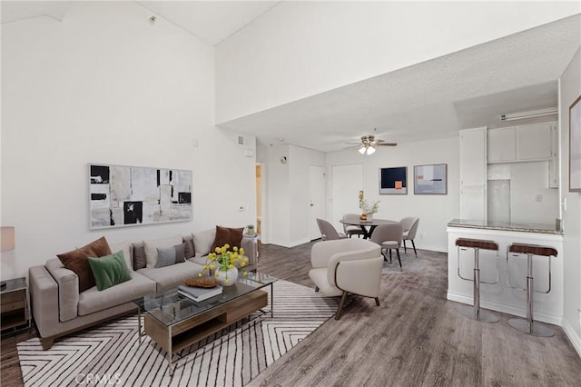 450 E 4th St Unit 419, Santa Ana, CA 92701 - living area featuring ceiling fan, wood finished floors, and a high ceiling