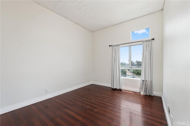 450 E 4th St Unit 419, Santa Ana, CA 92701 - spare room featuring baseboards and wood-type flooring