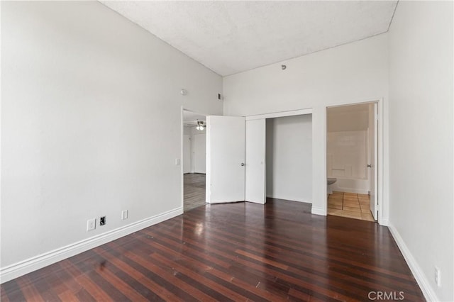 450 E 4th St Unit 419, Santa Ana, CA 92701 - unfurnished bedroom with wood finished floors, a closet, and ensuite bathroom