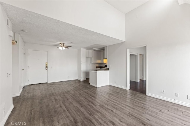 450 E 4th St Unit 419, Santa Ana, CA 92701 - unfurnished living room featuring a ceiling fan, dark wood-style flooring, and a textured ceiling