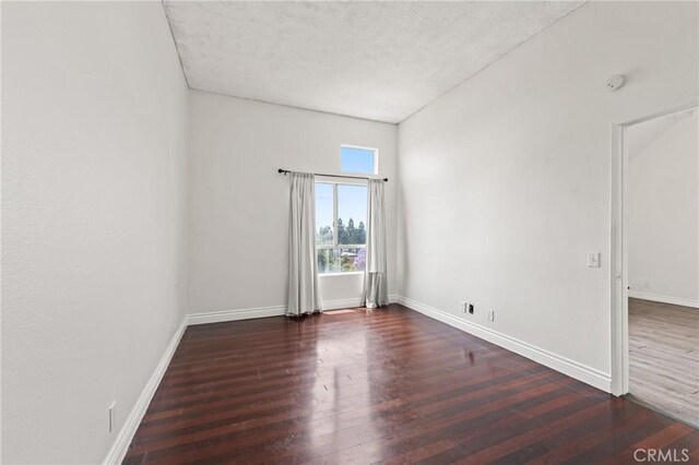 450 E 4th St Unit 419, Santa Ana, CA 92701 - empty room with wood finished floors, a textured ceiling, and a smoke detector