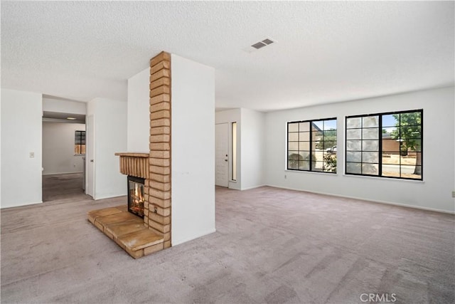 37224 Halfmoon Dr, Palmdale, CA 93550 - unfurnished living room featuring carpet floors, a fireplace, and a textured ceiling