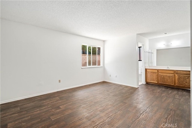 37224 Halfmoon Dr, Palmdale, CA 93550 - unfurnished living room featuring dark wood-type flooring and a textured ceiling