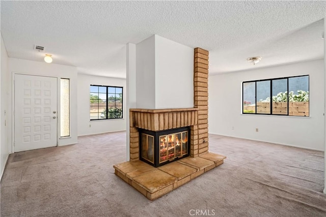 37224 Halfmoon Dr, Palmdale, CA 93550 - unfurnished living room featuring carpet flooring, a brick fireplace, and a textured ceiling