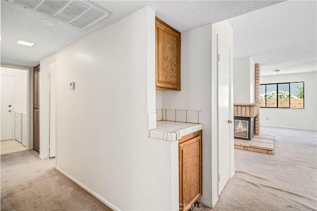 37224 Halfmoon Dr, Palmdale, CA 93550 - corridor featuring light colored carpet and a textured ceiling