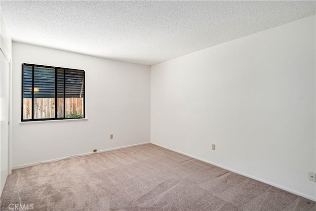37224 Halfmoon Dr, Palmdale, CA 93550 - spare room with carpet floors and a textured ceiling