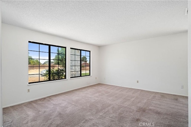 37224 Halfmoon Dr, Palmdale, CA 93550 - carpeted empty room with a textured ceiling and baseboards