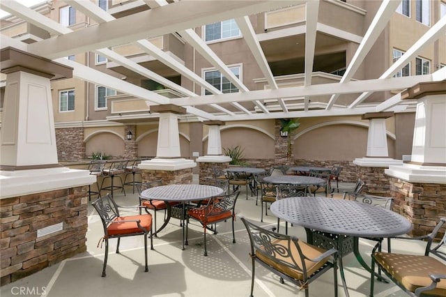 2750 Artesia Blvd Unit 313, Redondo Beach, CA 90278 - view of patio / terrace featuring outdoor dining space and a pergola