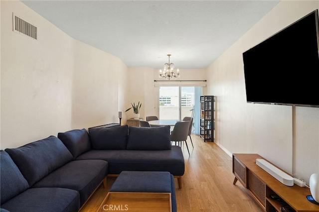 2750 Artesia Blvd Unit 313, Redondo Beach, CA 90278 - living area featuring light wood-style flooring and a chandelier