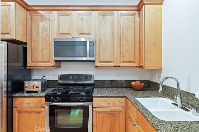 2750 Artesia Blvd Unit 313, Redondo Beach, CA 90278 - kitchen featuring appliances with stainless steel finishes and dark stone counters
