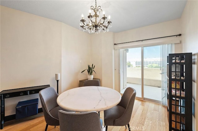 2750 Artesia Blvd Unit 313, Redondo Beach, CA 90278 - dining space featuring light wood-type flooring and a chandelier