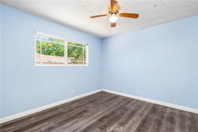 43236 W 20th St W, Lancaster, CA 93534 - empty room with dark wood finished floors, a textured ceiling, and ceiling fan