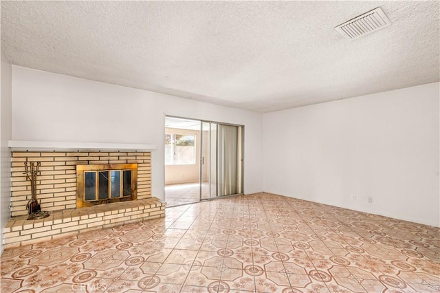 43236 W 20th St W, Lancaster, CA 93534 - unfurnished living room with a brick fireplace and a textured ceiling