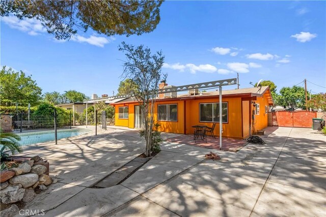 43236 W 20th St W, Lancaster, CA 93534 - rear view of property featuring a patio and a gate