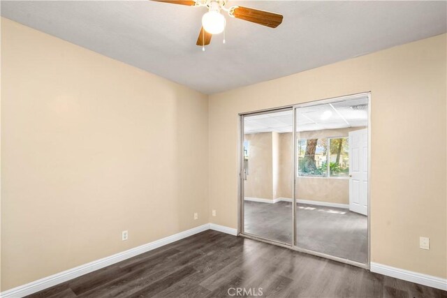 43236 W 20th St W, Lancaster, CA 93534 - unfurnished bedroom with dark wood-style floors, a closet, and ceiling fan