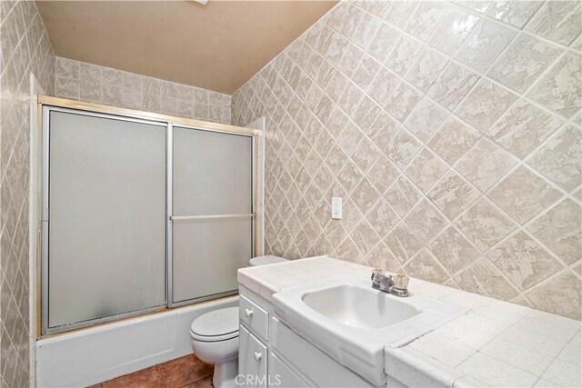 43236 W 20th St W, Lancaster, CA 93534 - bathroom with enclosed tub / shower combo, vanity, tile patterned floors, tile walls, and decorative backsplash
