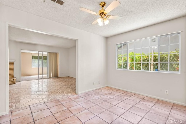 43236 W 20th St W, Lancaster, CA 93534 - unfurnished room featuring a textured ceiling, light tile patterned floors, and a ceiling fan