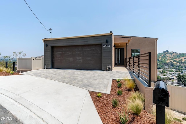 3874 W Point Dr, Los Angeles, CA 90065 - view of front of house with an attached garage and driveway