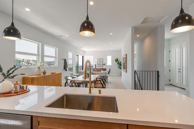3874 W Point Dr, Los Angeles, CA 90065 - kitchen featuring stainless steel dishwasher, open floor plan, recessed lighting, decorative light fixtures, and light stone countertops