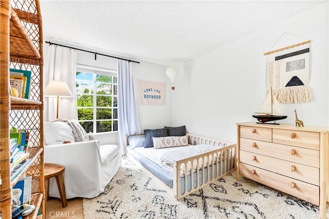 1442 Brett Pl Unit 31, San Pedro, CA 90732 - bedroom featuring a textured ceiling and wood finished floors