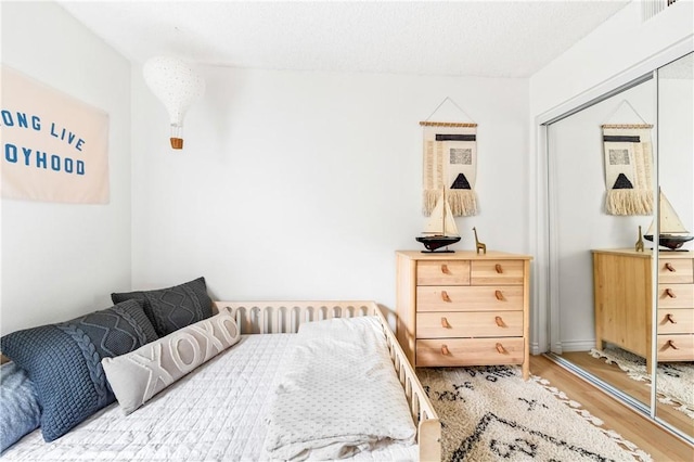 1442 Brett Pl Unit 31, San Pedro, CA 90732 - bedroom with wood finished floors and a closet