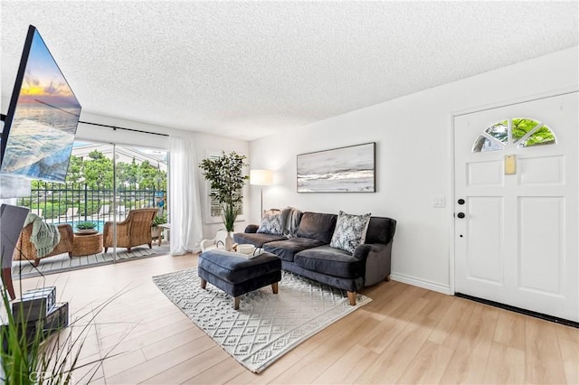 1442 Brett Pl Unit 31, San Pedro, CA 90732 - living room with a textured ceiling and wood finished floors