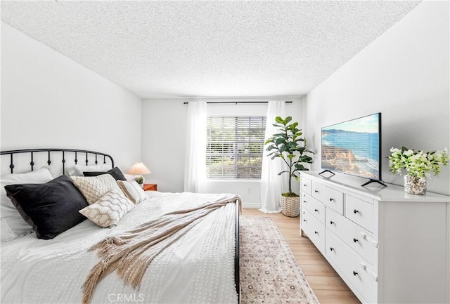1442 Brett Pl Unit 31, San Pedro, CA 90732 - bedroom with light wood-type flooring and a textured ceiling