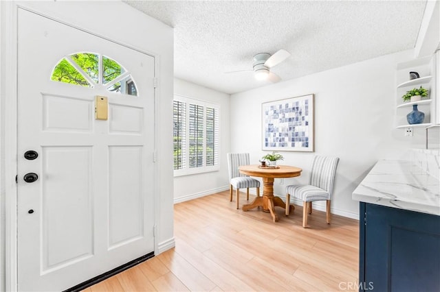 1442 Brett Pl Unit 31, San Pedro, CA 90732 - entryway with light wood finished floors, a ceiling fan, and a textured ceiling