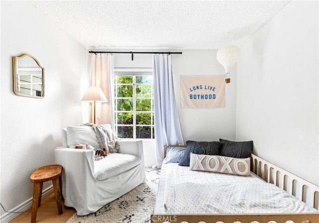 1442 Brett Pl Unit 31, San Pedro, CA 90732 - bedroom featuring a textured ceiling and wood finished floors