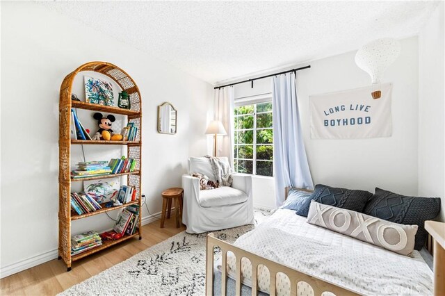 1442 Brett Pl Unit 31, San Pedro, CA 90732 - bedroom with a textured ceiling and wood finished floors