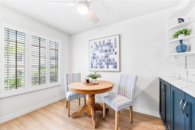 1442 Brett Pl Unit 31, San Pedro, CA 90732 - dining room featuring a textured ceiling, light wood-style floors, and a ceiling fan