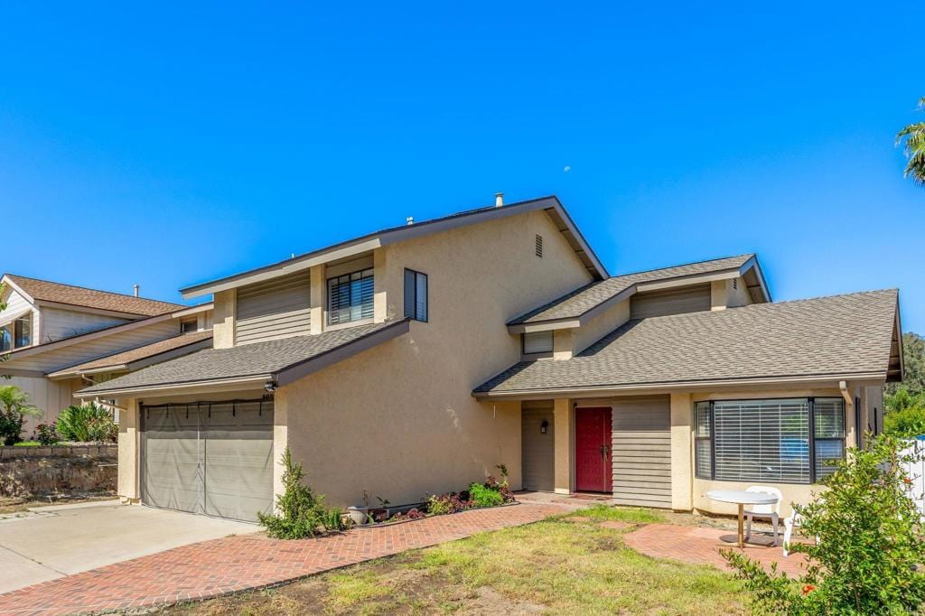 2022 Seca St, El Cajon, CA 92019 - view of front of home with stucco siding, a shingled roof, and driveway