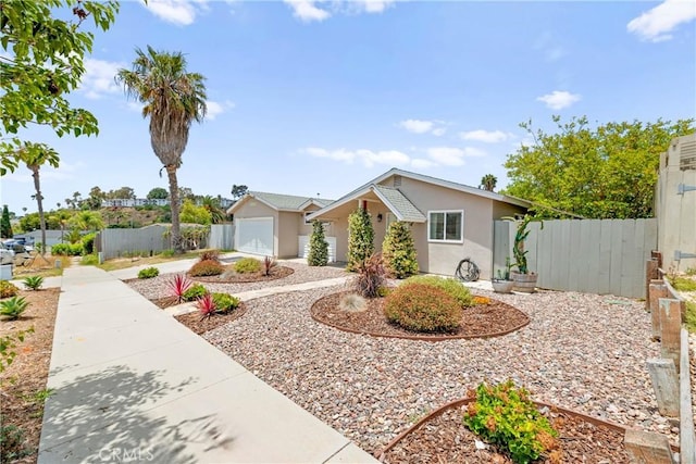 4054 Lewis St, Oceanside, CA 92056 - view of front of house with stucco siding, driveway, and a garage