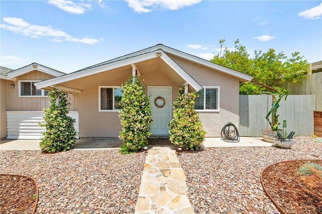 4054 Lewis St, Oceanside, CA 92056 - view of front of home with stucco siding and a patio area