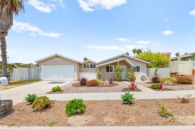4054 Lewis St, Oceanside, CA 92056 - view of front of home with driveway, a garage, and stucco siding