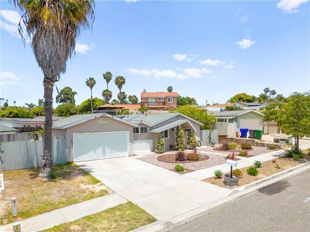 4054 Lewis St, Oceanside, CA 92056 - view of front of property featuring an attached garage, concrete driveway, and stucco siding
