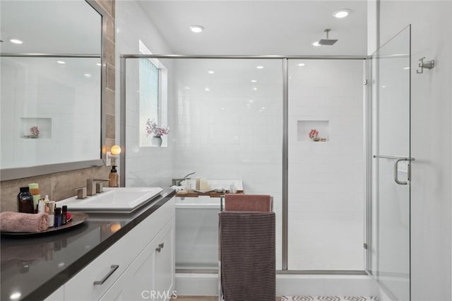 131 Spiral, Irvine, CA 92618 - full bath with vanity, a stall shower, tile walls, a freestanding tub, and recessed lighting